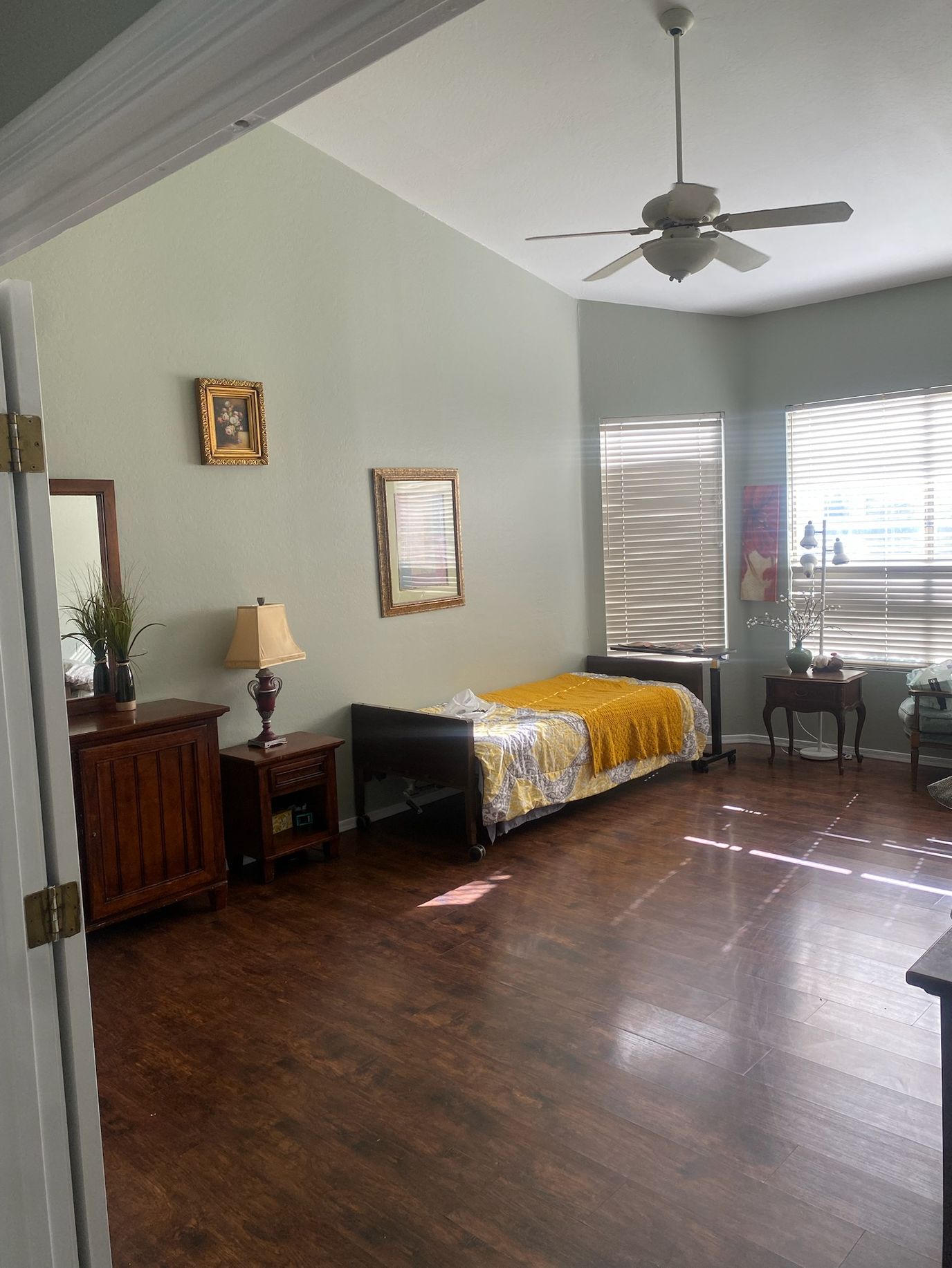 Bright interior of a resident room with wooden floor