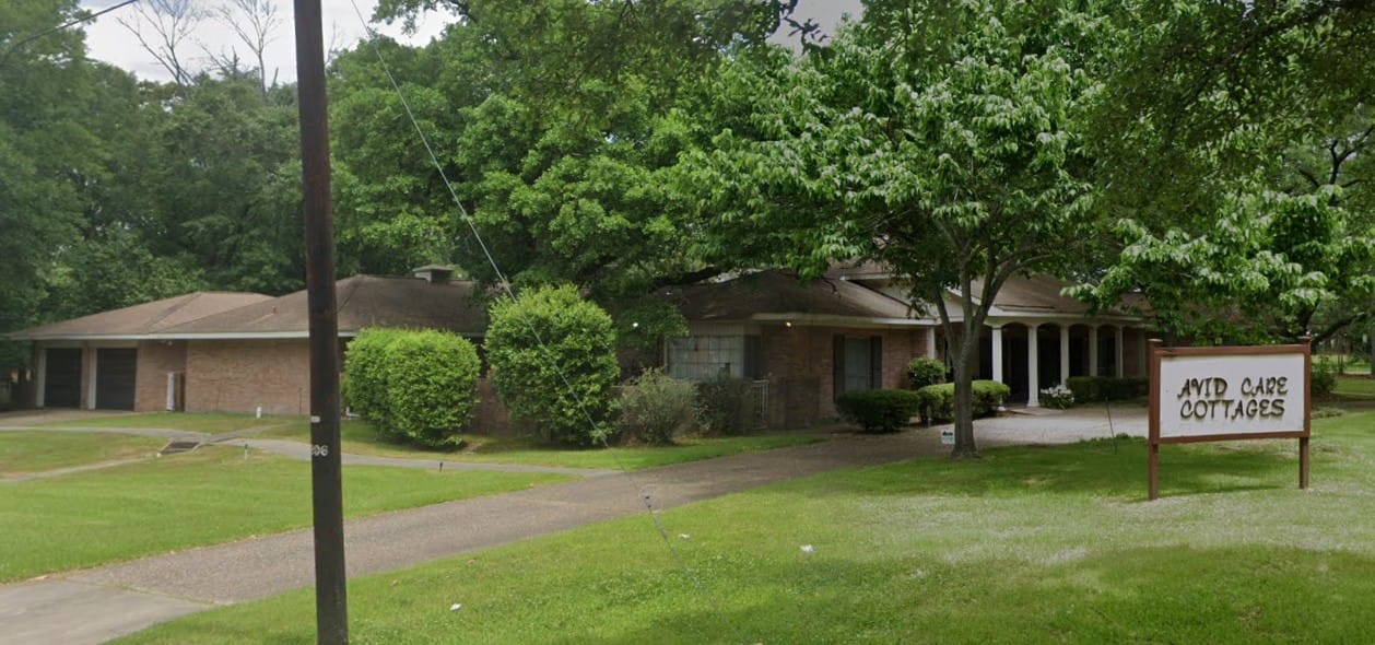 Exterior view of Avid Care Cottages with greenery