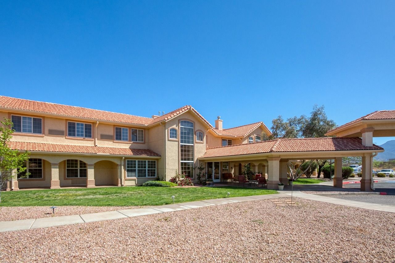 Exterior view of a nursing home building with landscaping