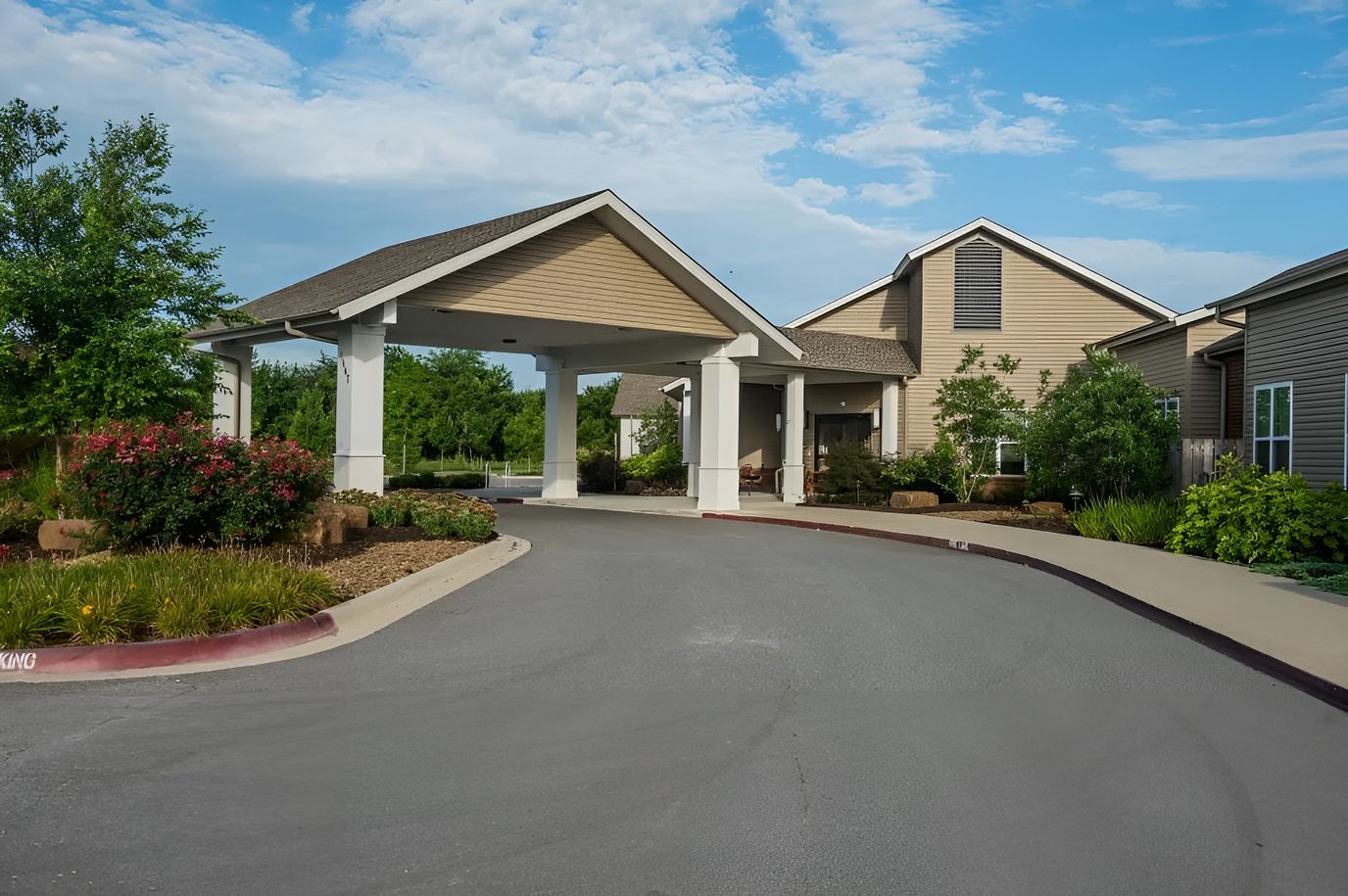 Exterior view of the facility entrance and landscaped area