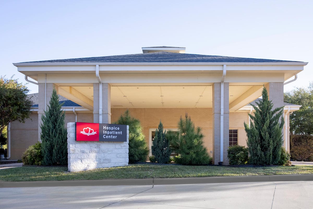 Exterior view of the hospice building with signage