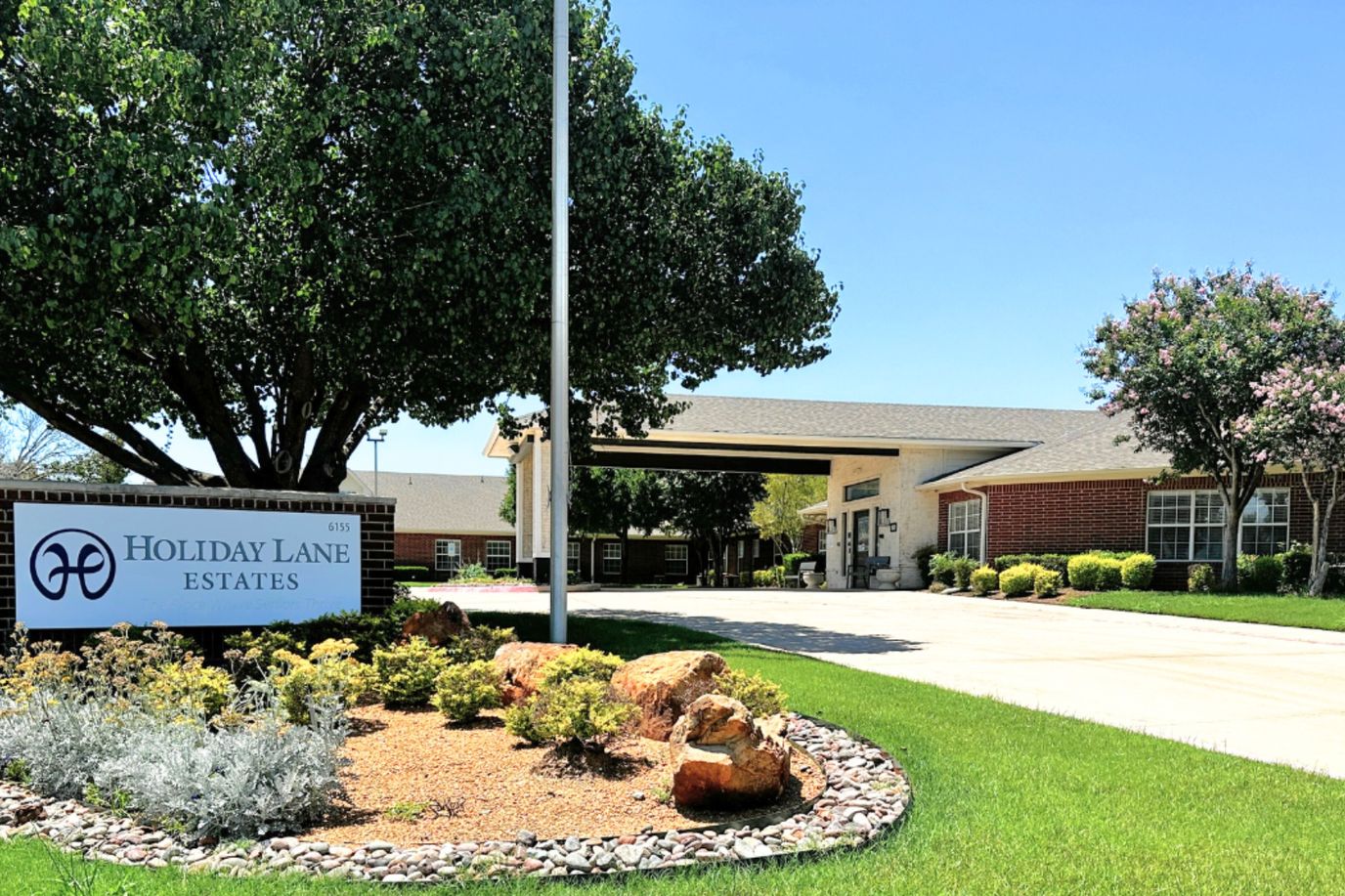 Exterior view of Holiday Lane Estates with landscaping