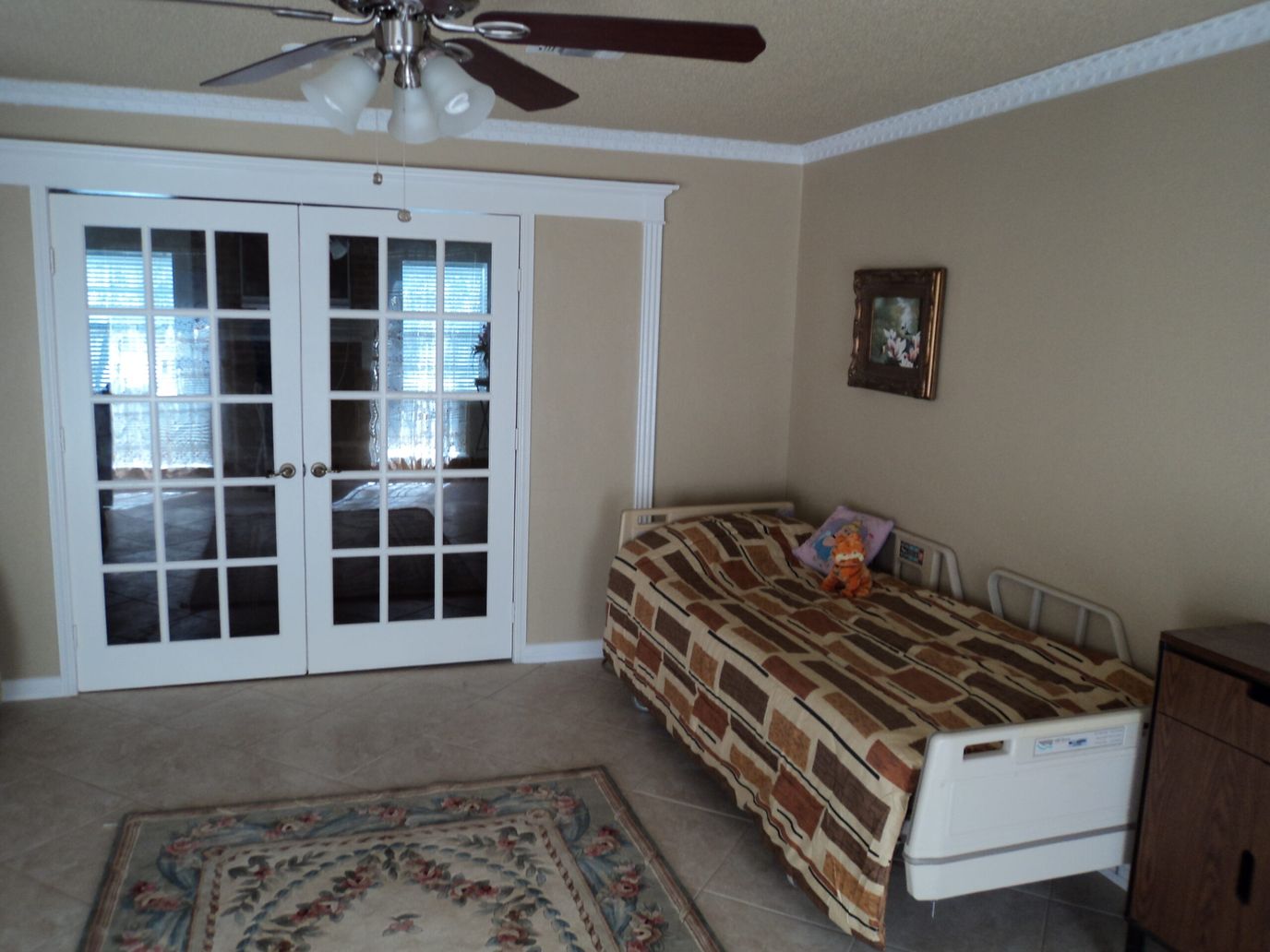 Interior view of a resident room with a bed and decor