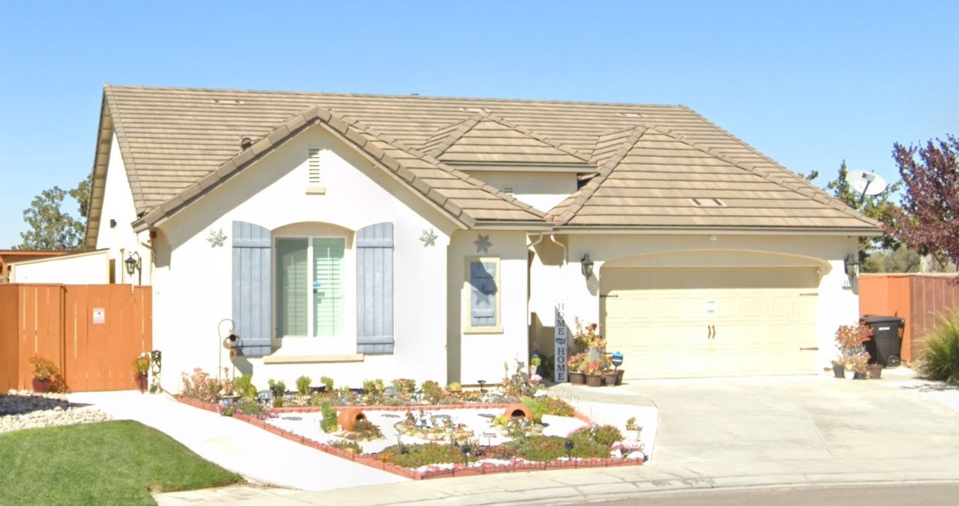 Exterior view of a residential facility with garden