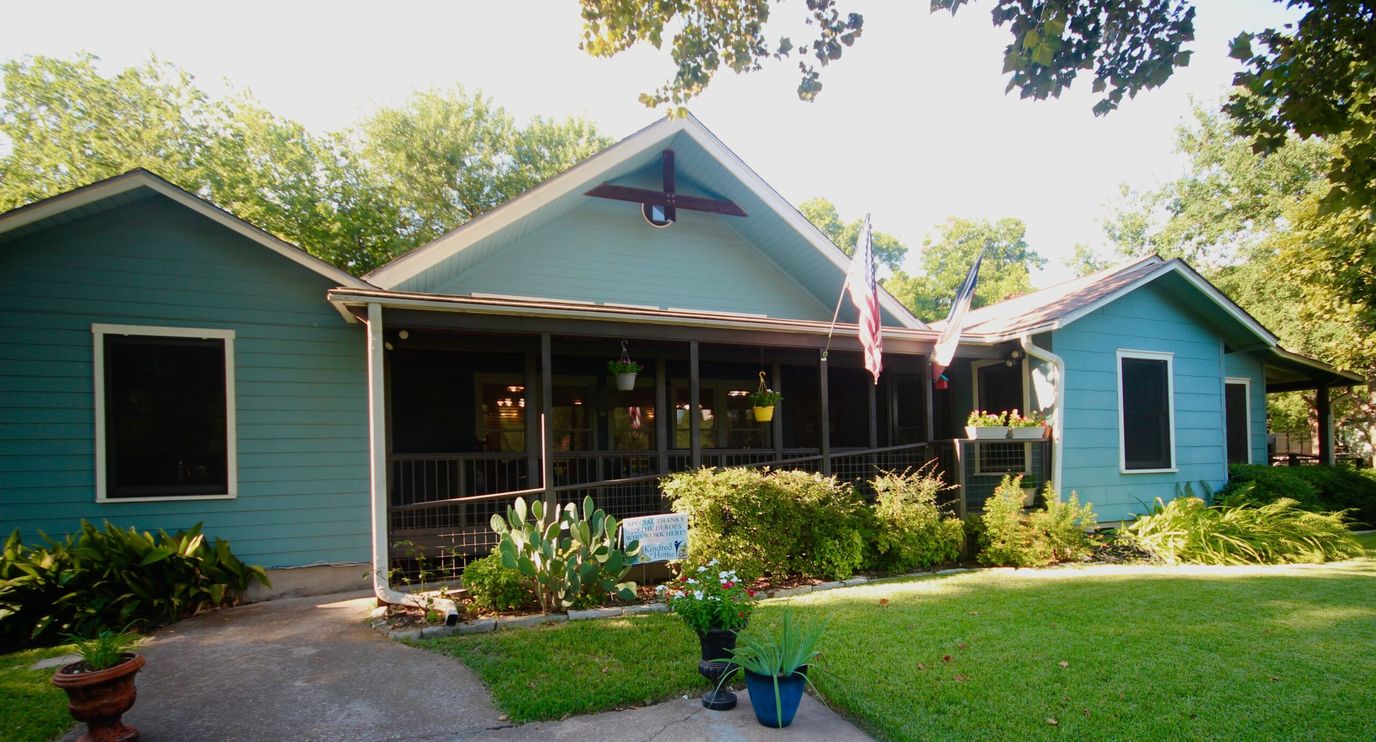 Exterior view of a charming senior living facility.