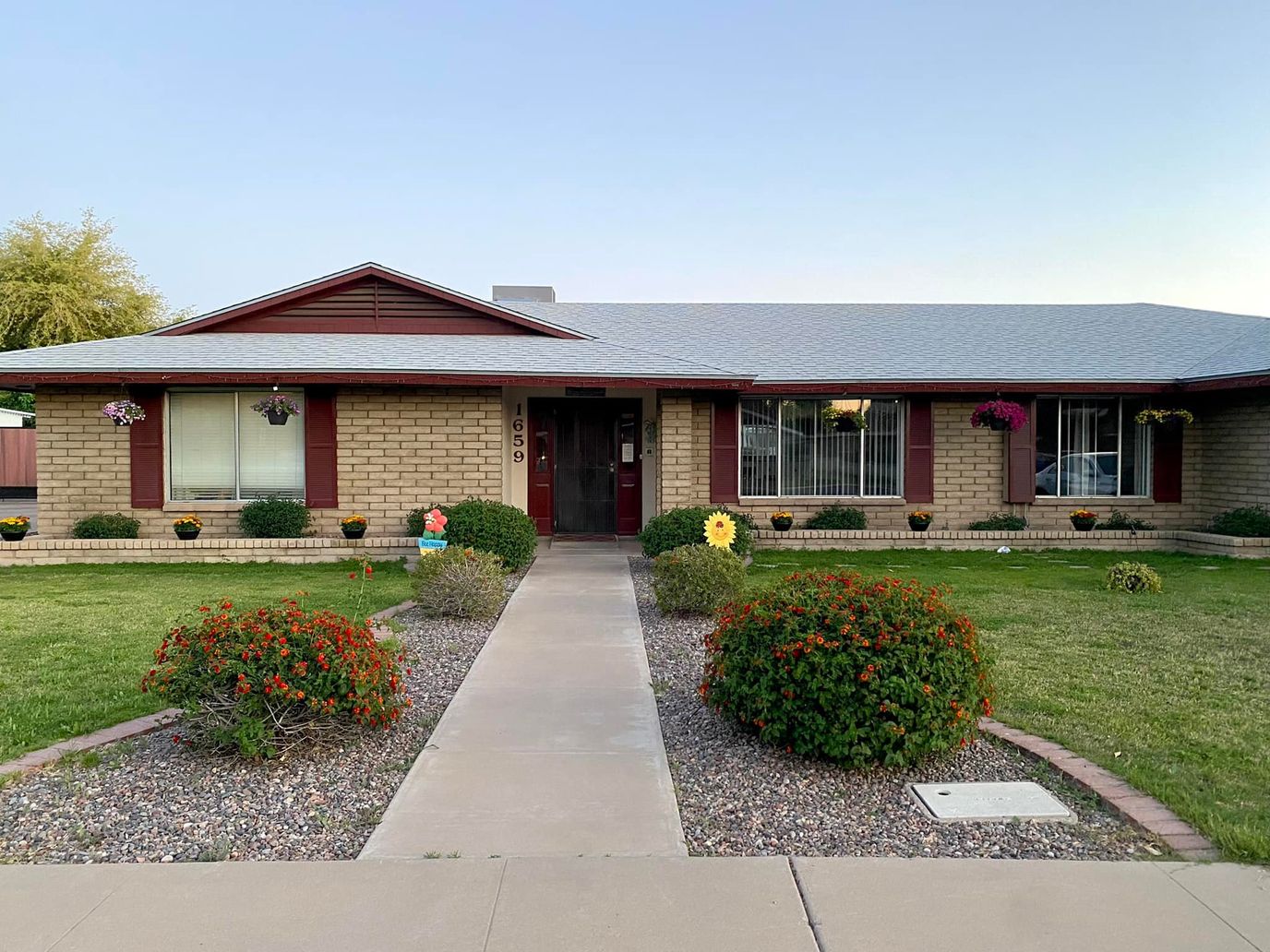 Exterior view of a senior living facility with landscaping