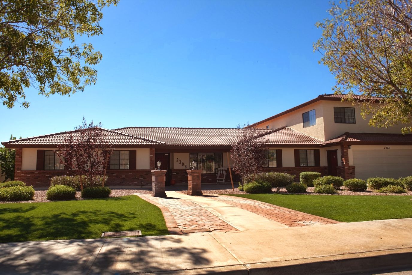 Exterior view of a senior living facility with landscaping