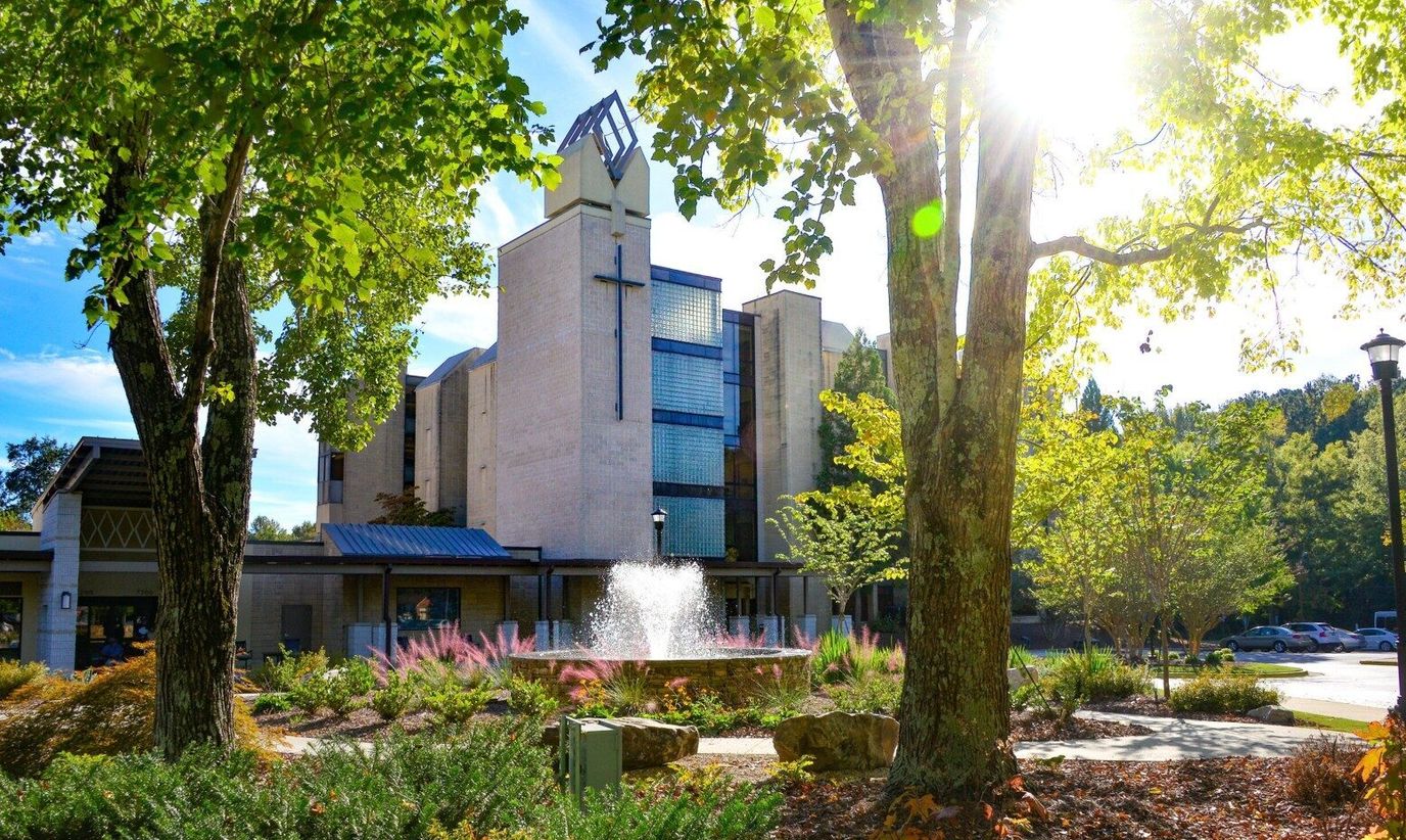 Exterior view of the assisted living facility with fountain