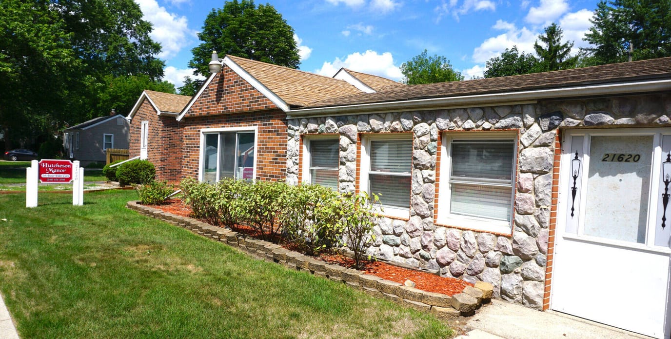 Exterior view of Hutcheson Manor with garden