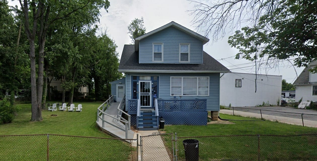 Exterior view of a blue assisted living facility