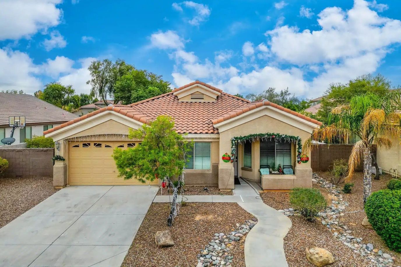 Exterior view of a single-family home with landscaping