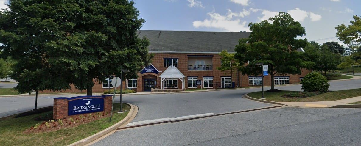 Exterior view of BridgingLife facility with signage