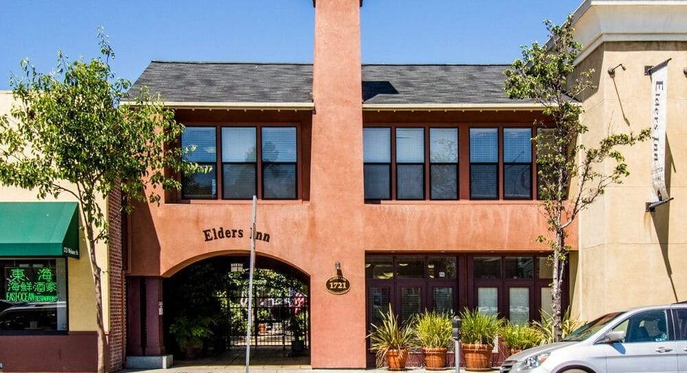 Exterior view of Elders Inn on Webster with signage