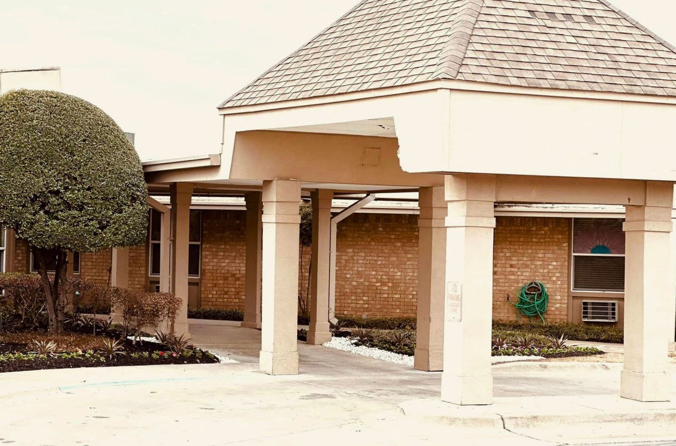 Entrance area of a senior living facility with landscaping