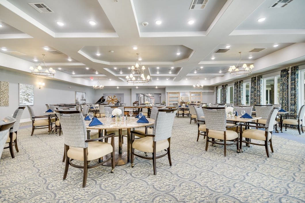 Brightly lit dining room with elegant table settings