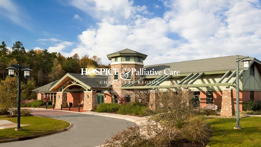 Exterior view of hospice facility with logo