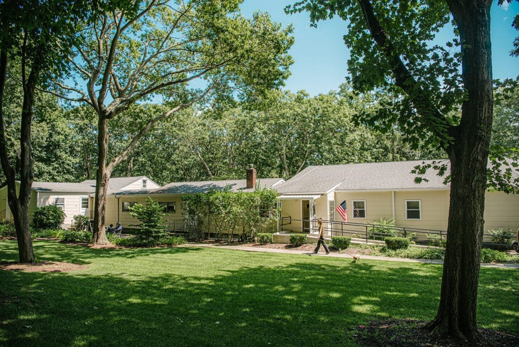 Exterior view of Olsen Rest Home with garden