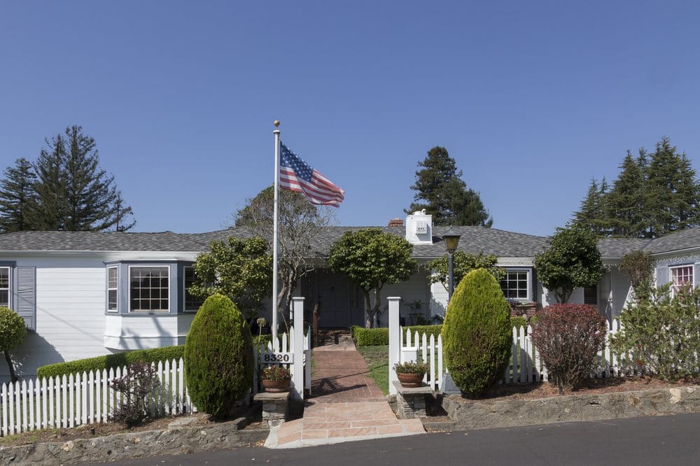 Exterior view of a senior care facility with landscaped entrance