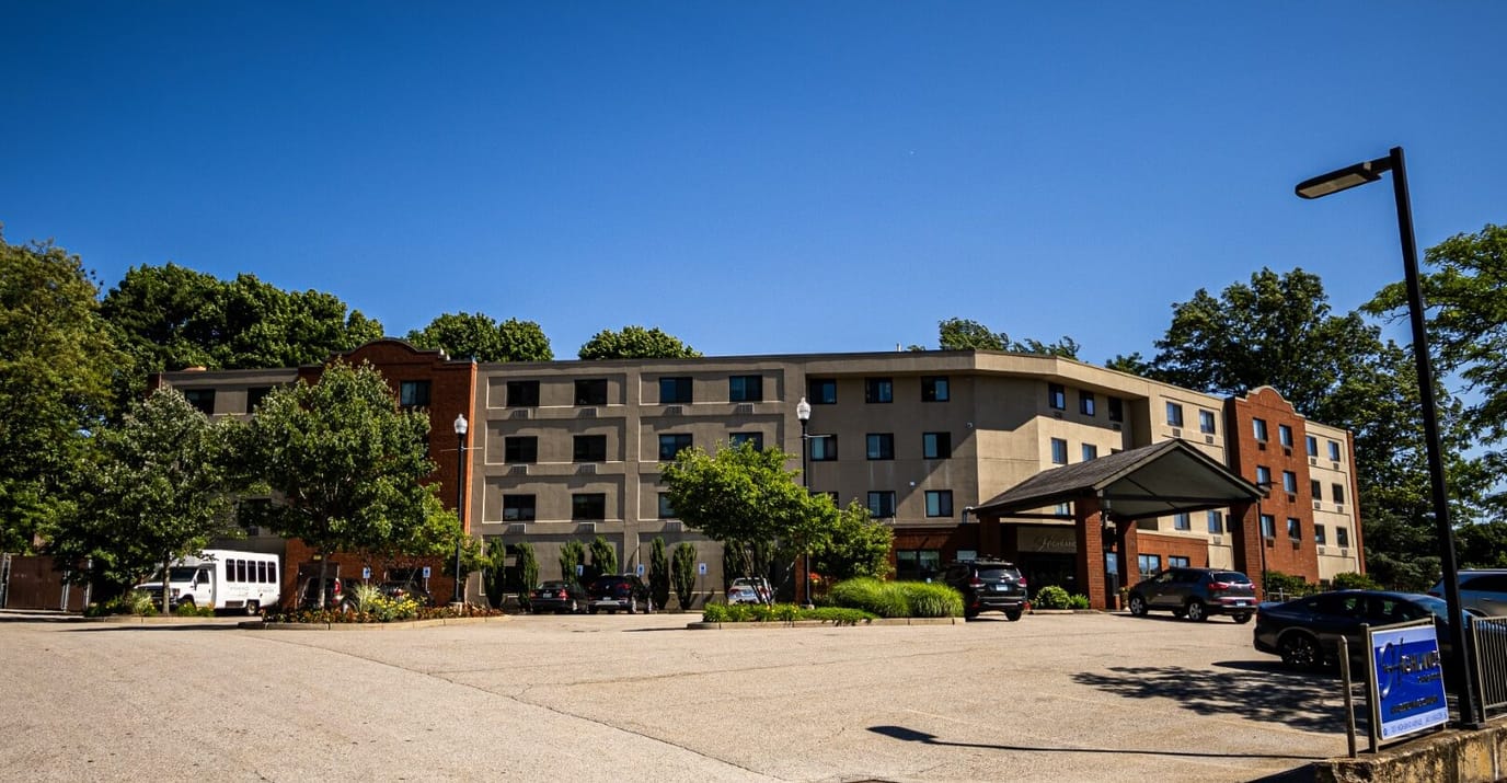 Exterior view of the Highlands on the East Side facility with parking