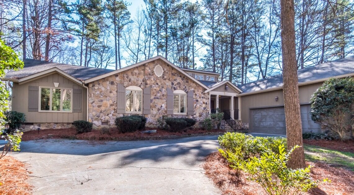 Exterior view of a senior living facility with trees