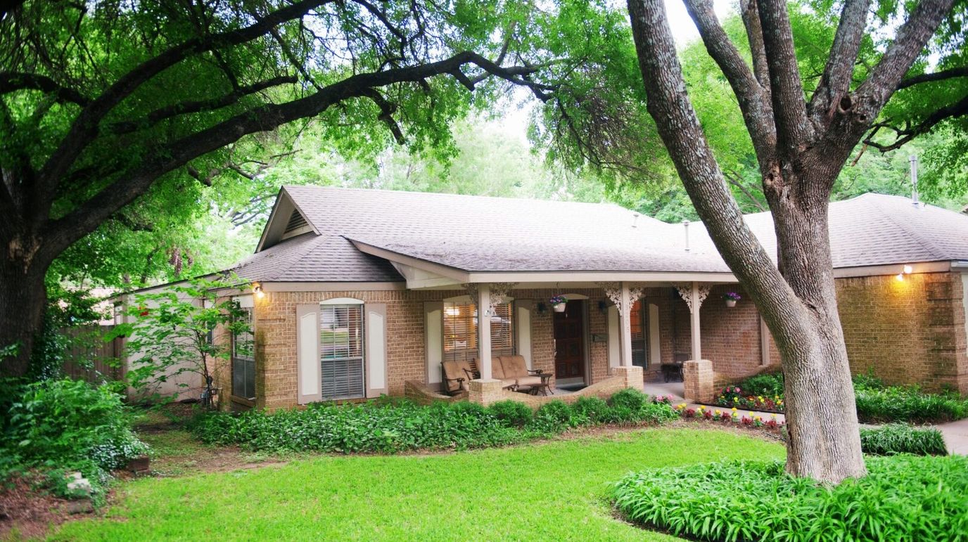 Exterior view of The Collinfield House surrounded by greenery