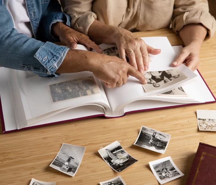 Two residents sharing memories over an album