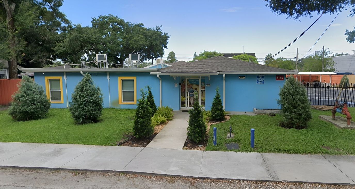 Exterior view of a colorful assisted living facility