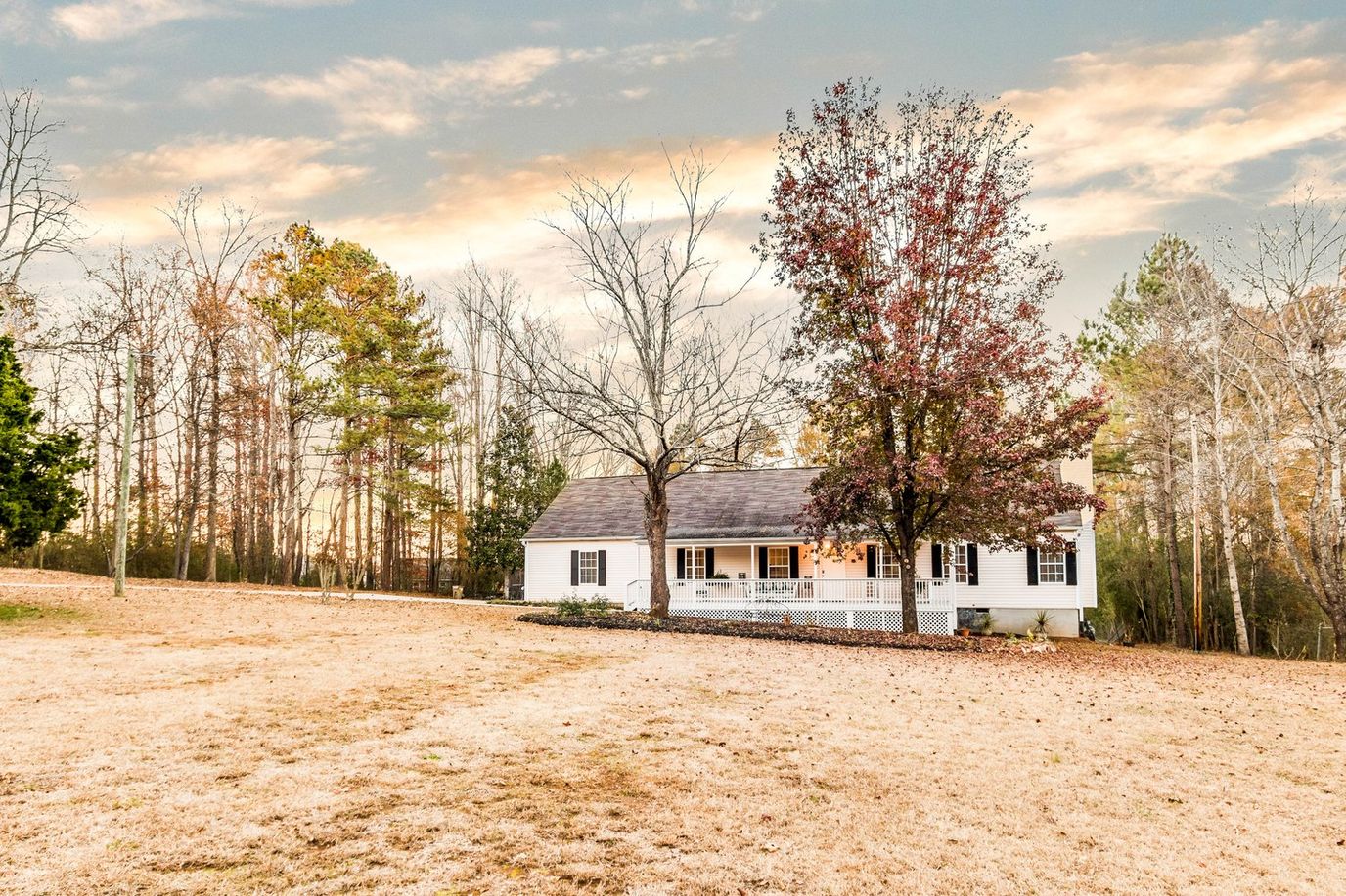 Exterior view of a cozy senior care facility surrounded by trees