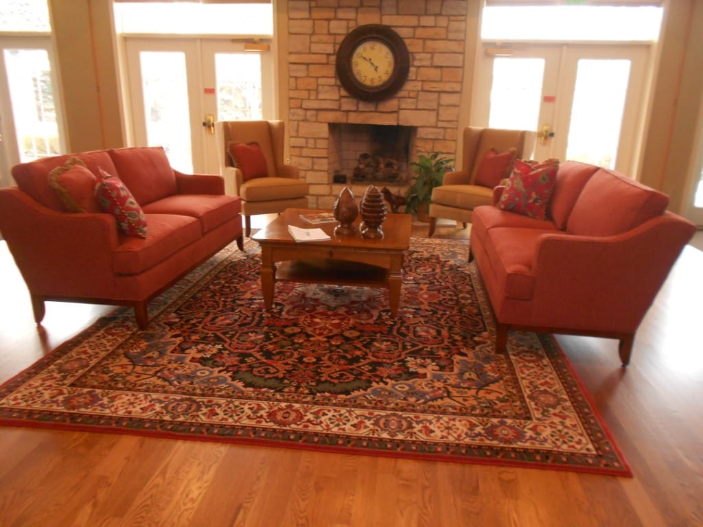 Comfortable seating area with a stone fireplace