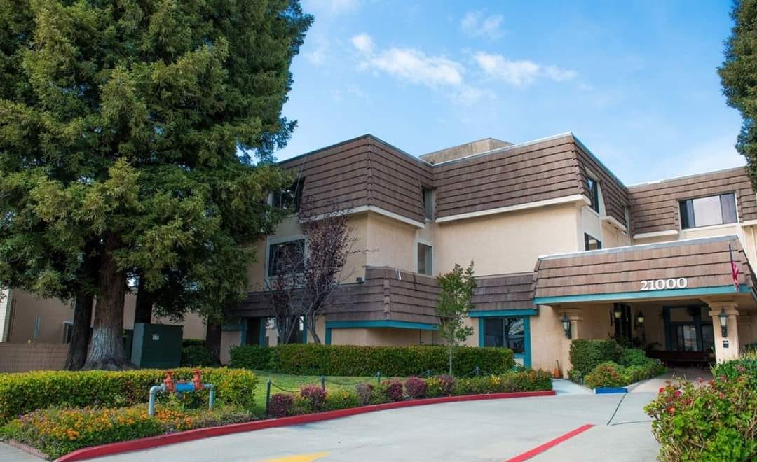 Exterior view of Landmark Villa with landscaping