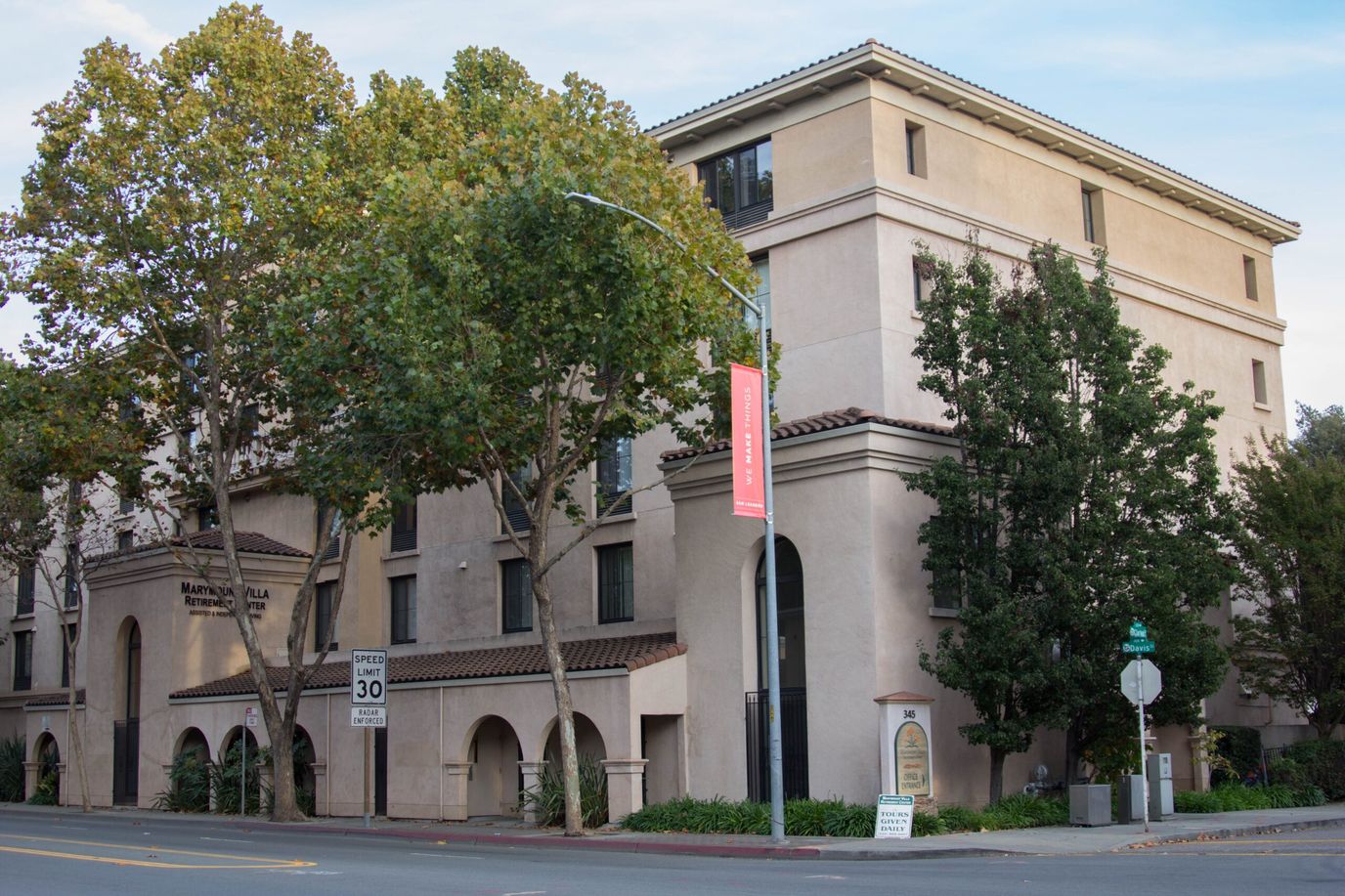 Exterior view of Marymount Villa with trees