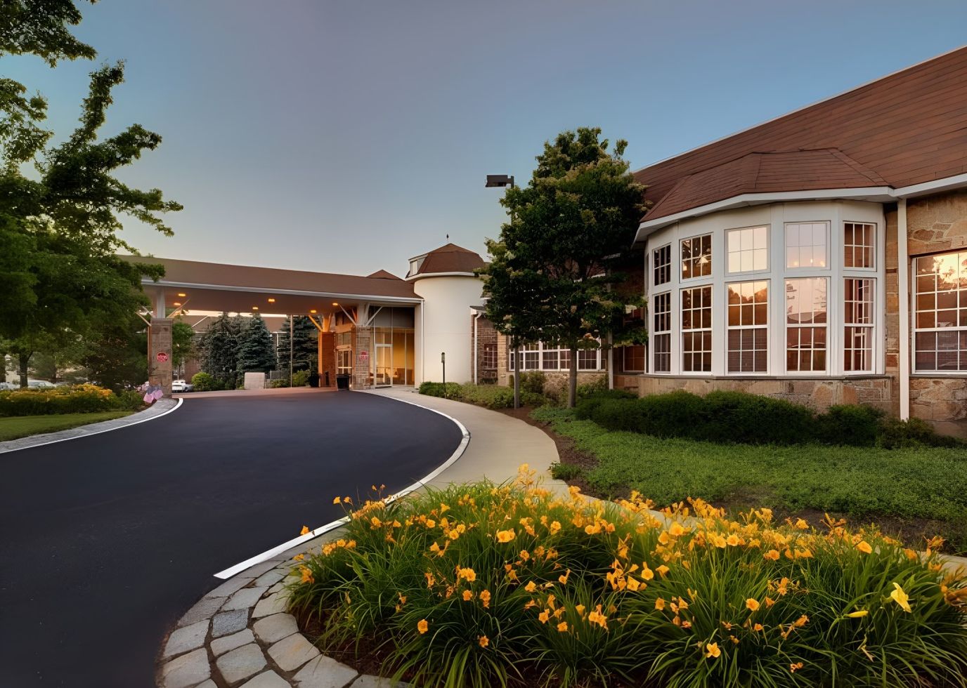Exterior view of Normandy Farms Estates with landscaped garden