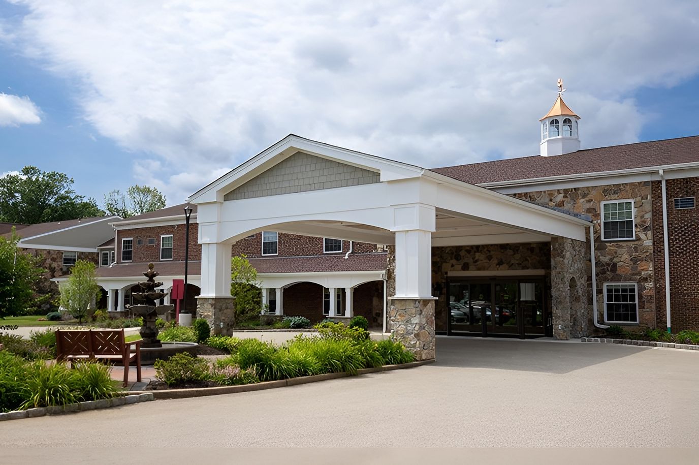 Front entrance of Spring House Estates with landscaped path