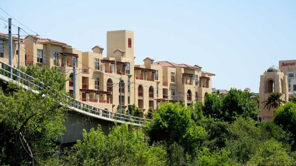 Exterior view of a senior living facility surrounded by greenery