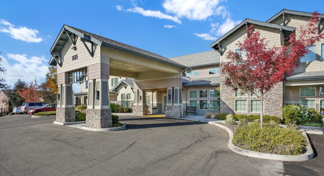 Exterior view of Almond Heights entrance with landscaped area