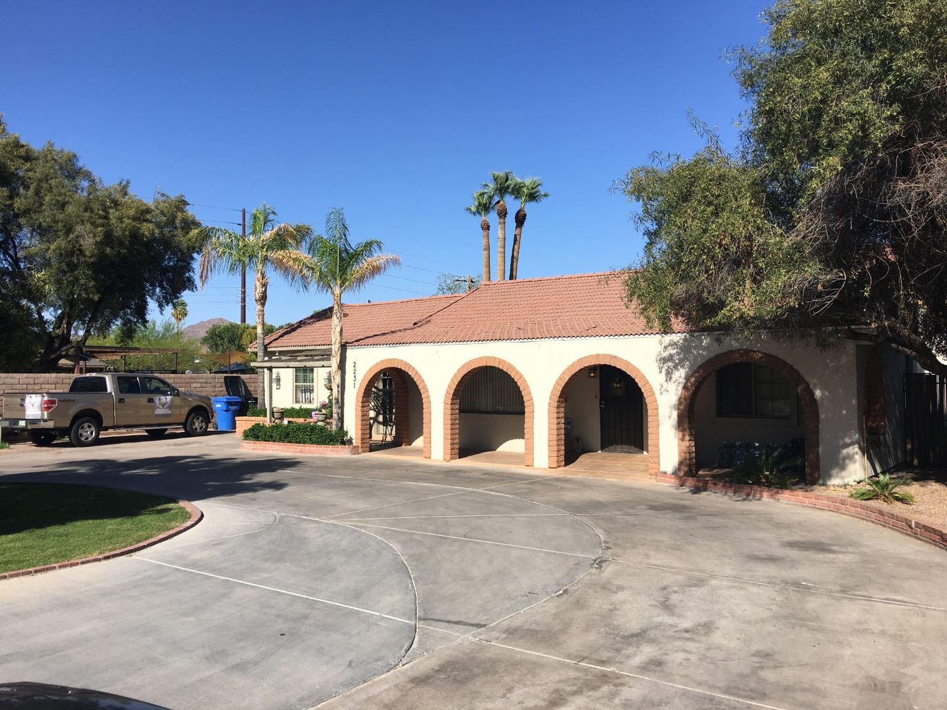 Exterior view of an assisted living facility with parking area