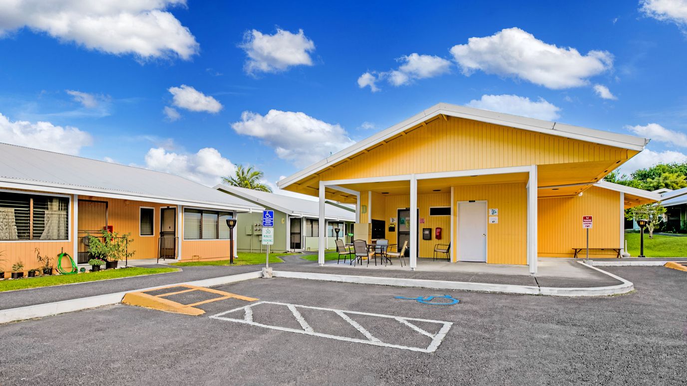 Exterior view of a colorful assisted living building