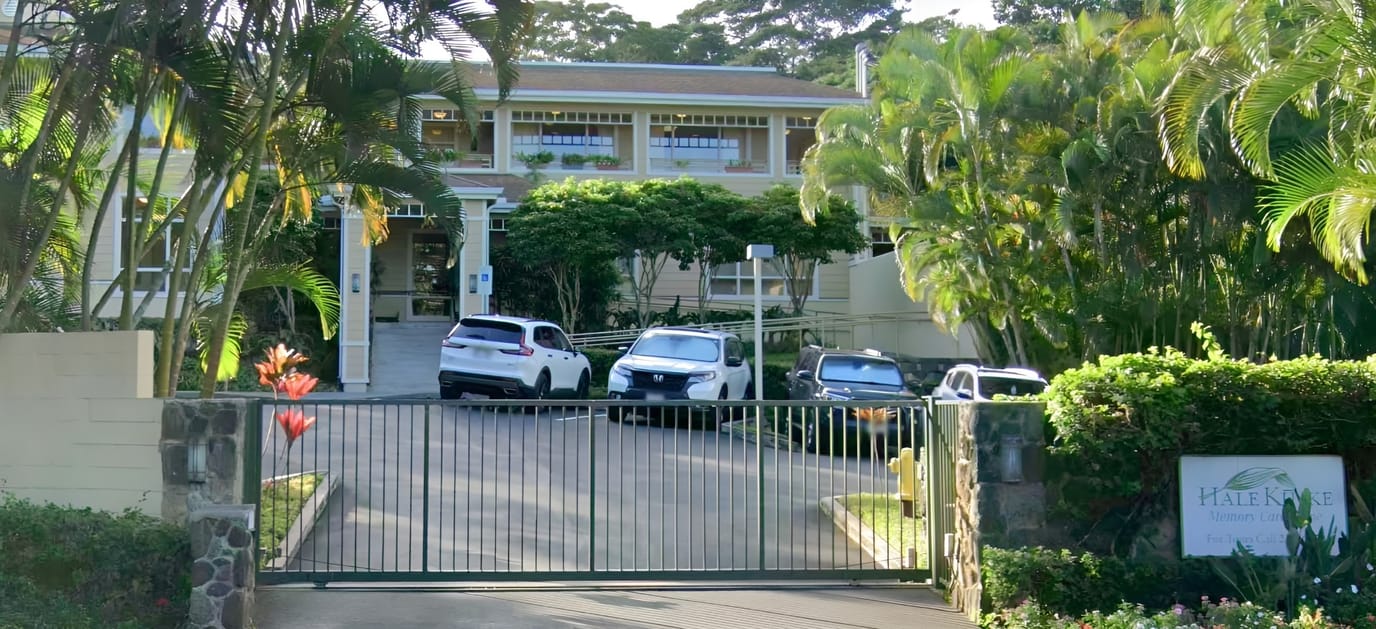 Exterior view of Hale Ku'ike Bayside with vehicles and greenery