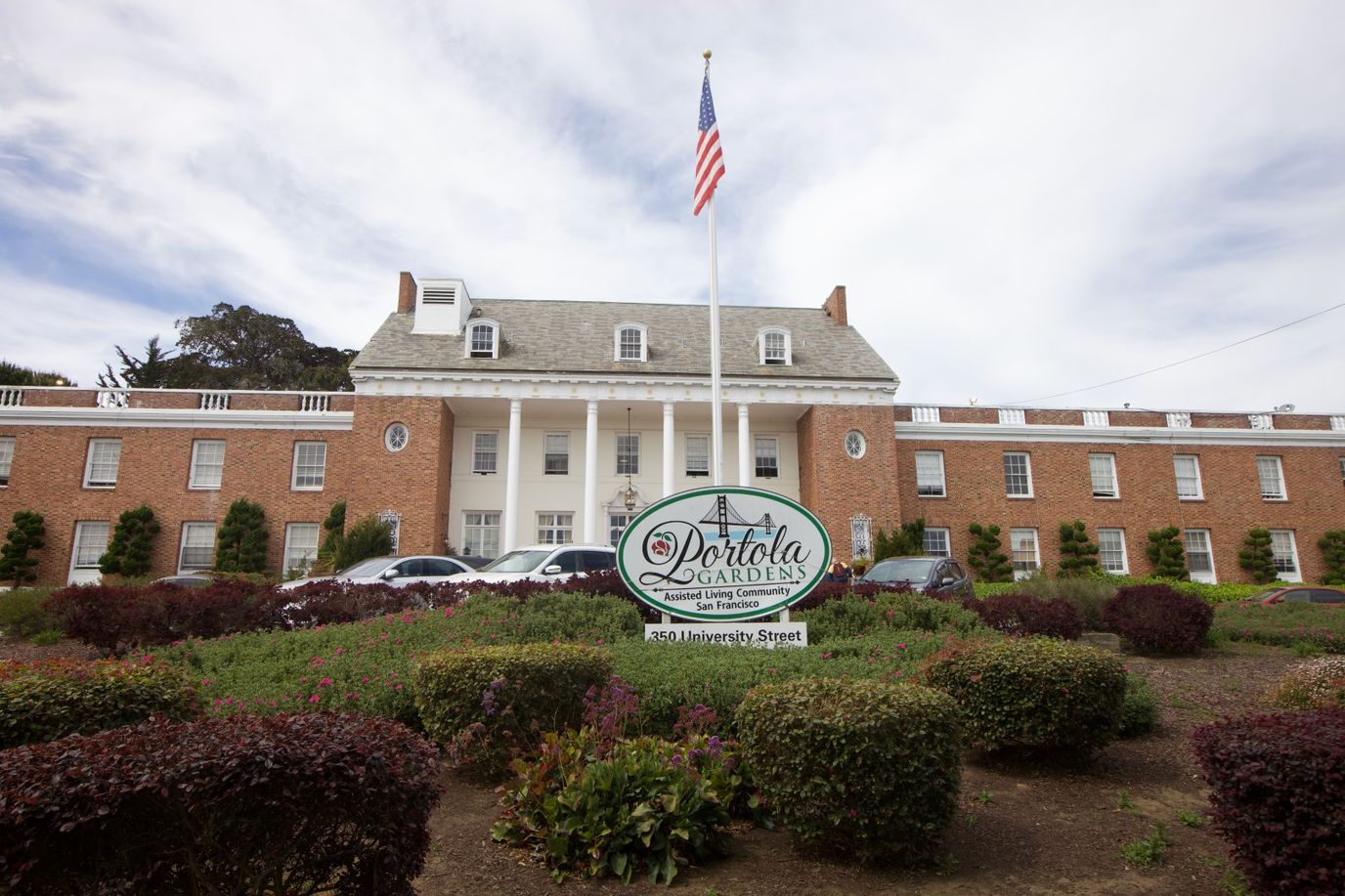 Exterior view of Portola Gardens facility with landscaping