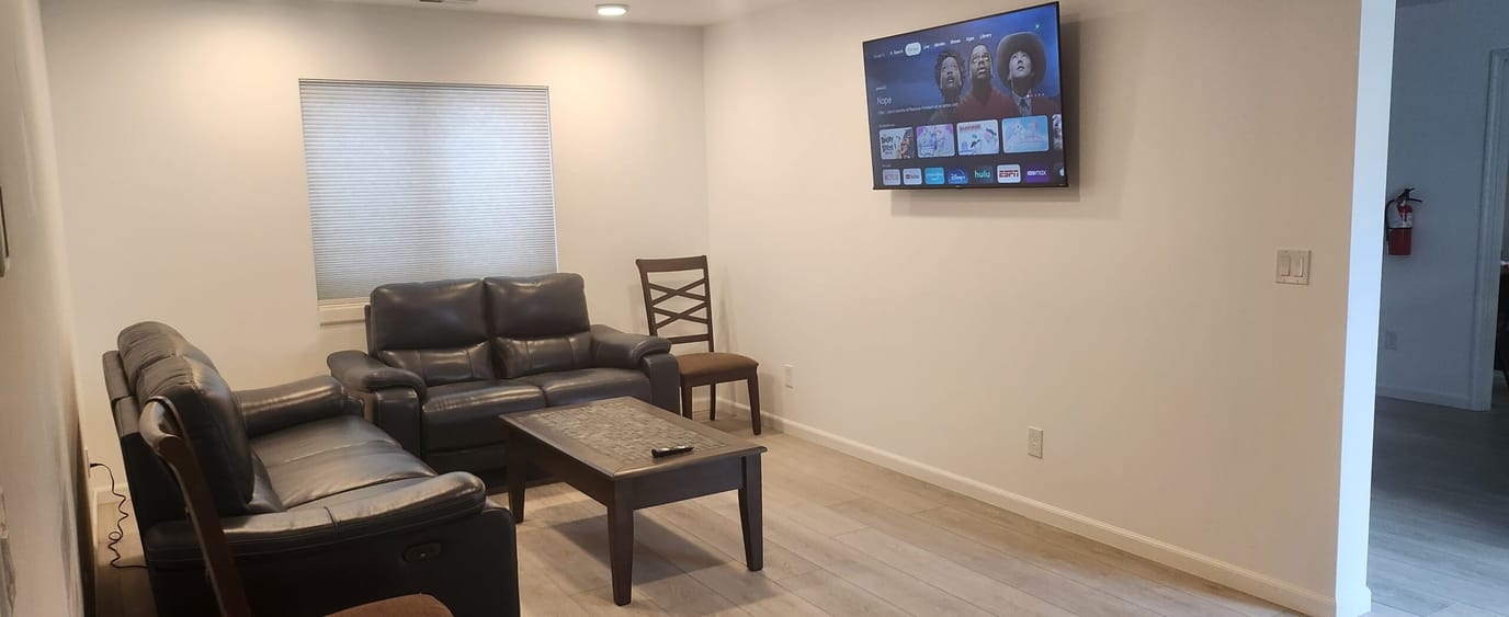 Common area with seating and TV