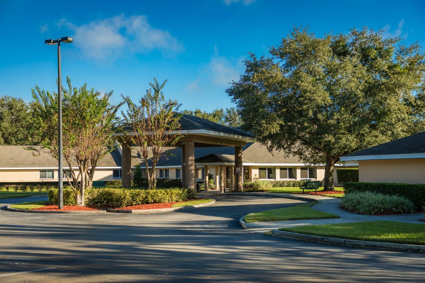 Front entrance of Lake Bennet Center surrounded by landscaping