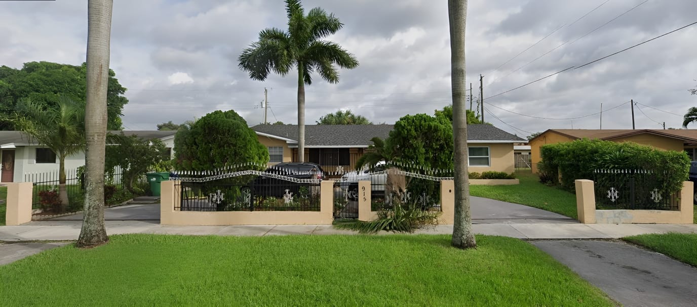 Exterior view of Miami Gardens Manor with lush landscaping