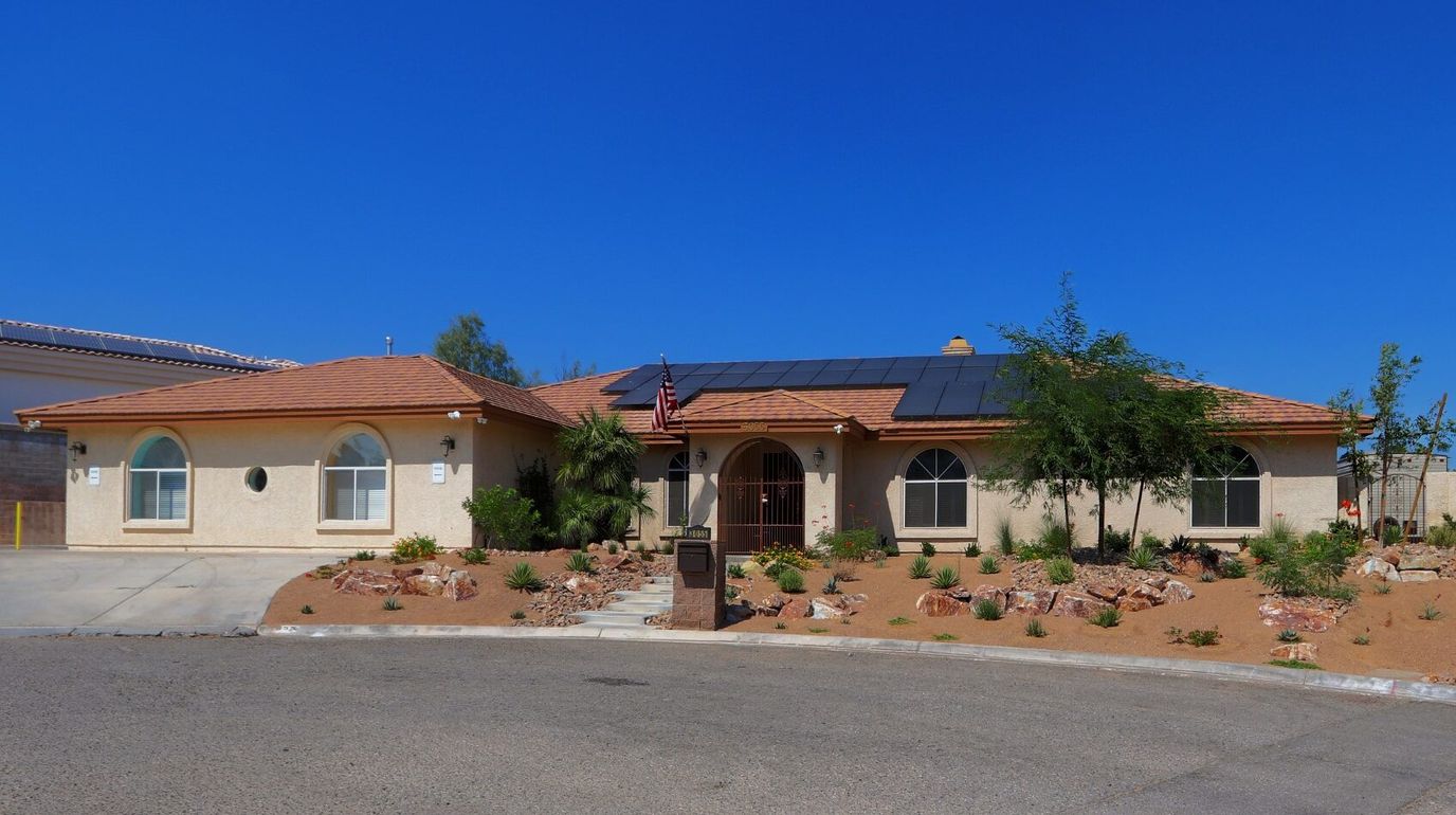 Exterior view of Mimi's Care Home with garden