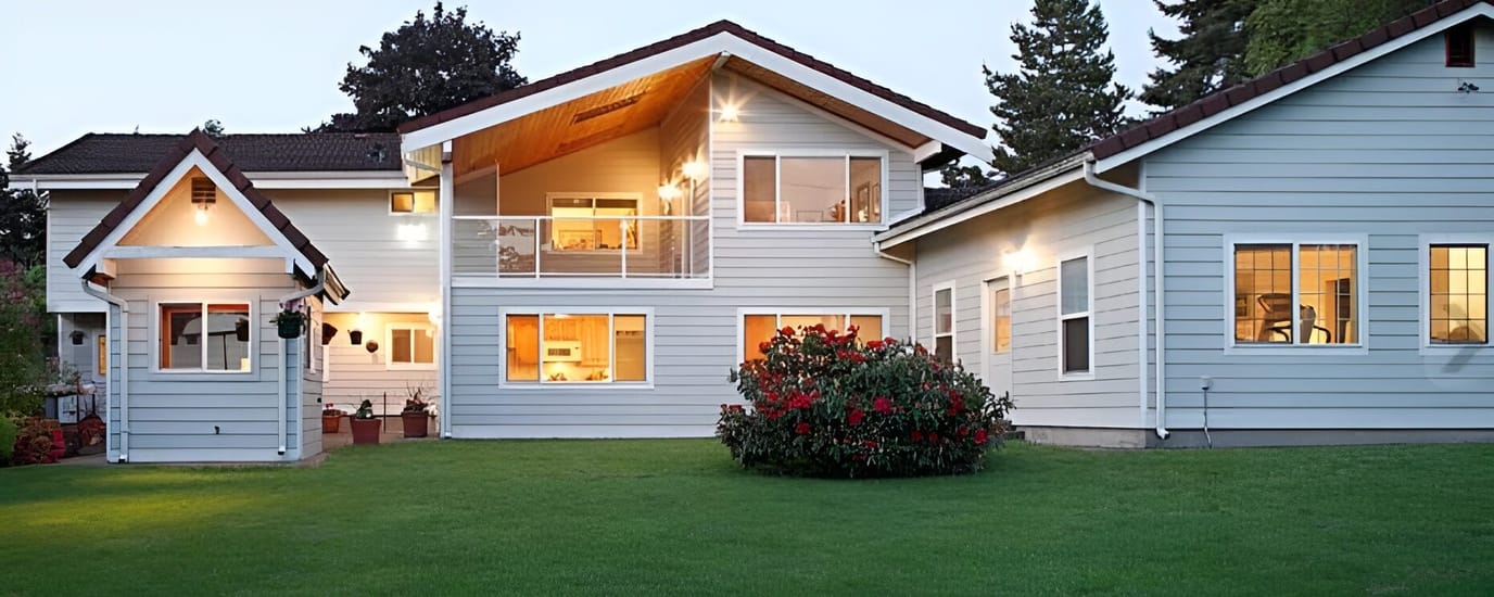 Exterior view of a residential facility with landscaped yard