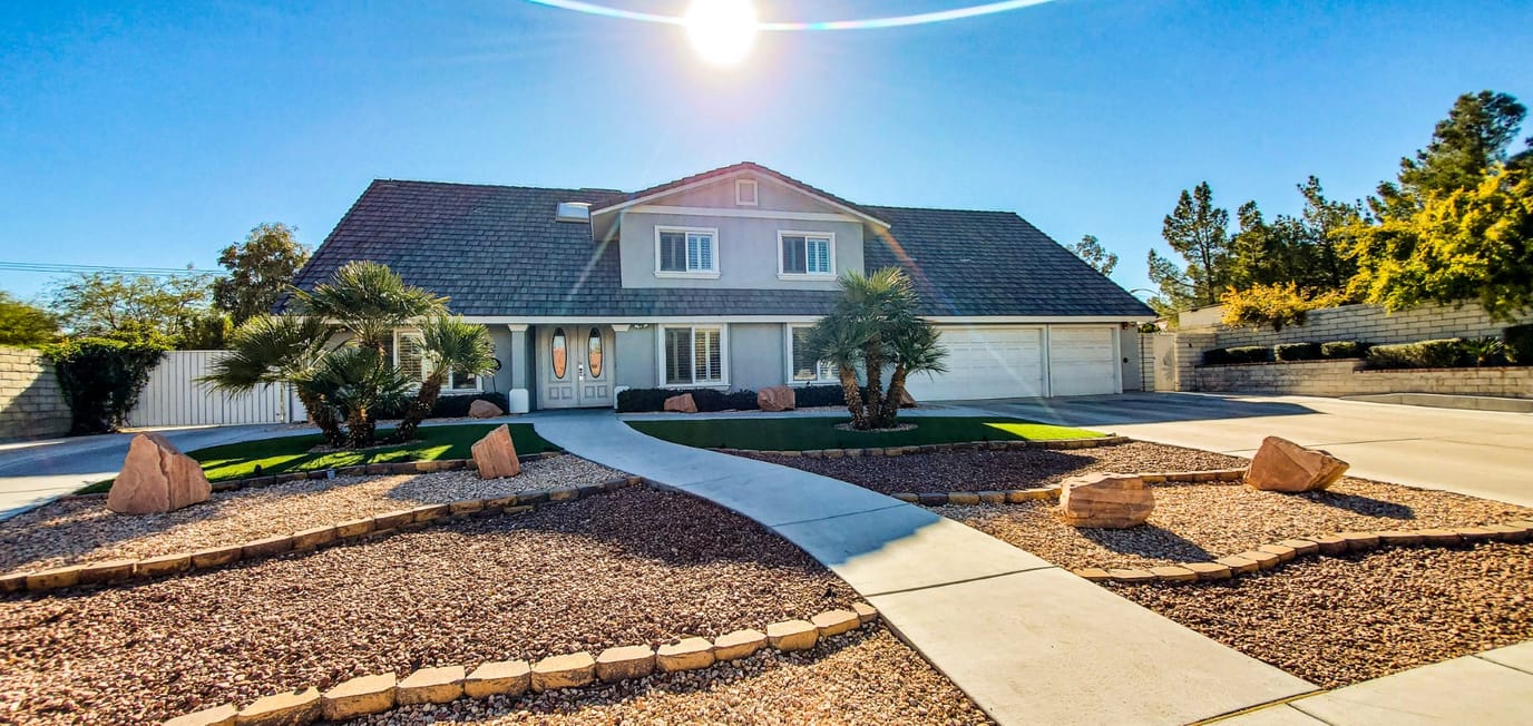 Exterior view of a senior living facility with garden landscaping
