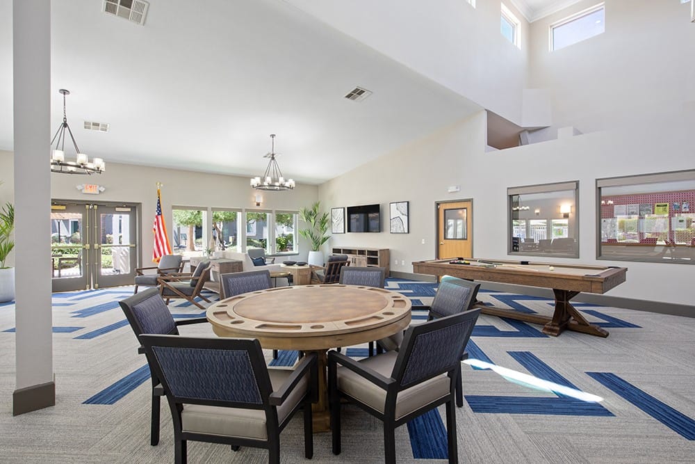 Bright common area with seating and tables