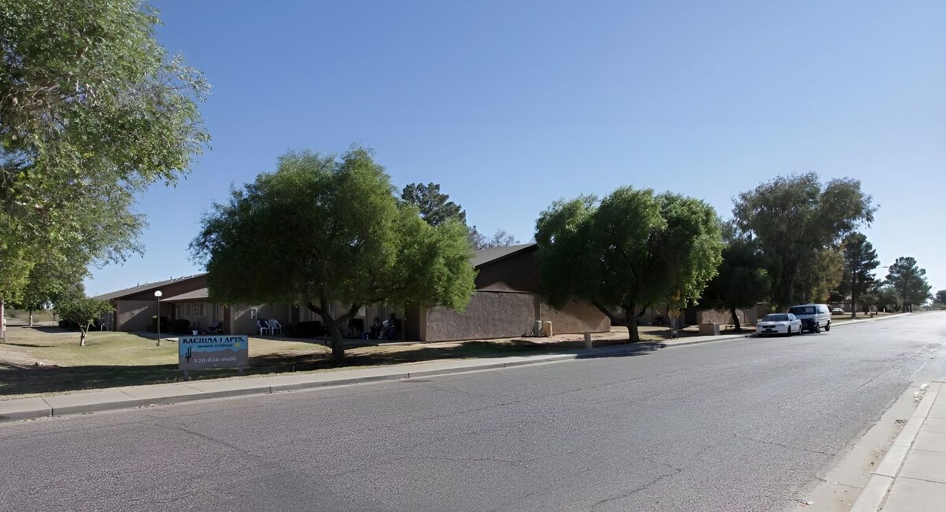 Exterior view of Kachina Apartments with trees