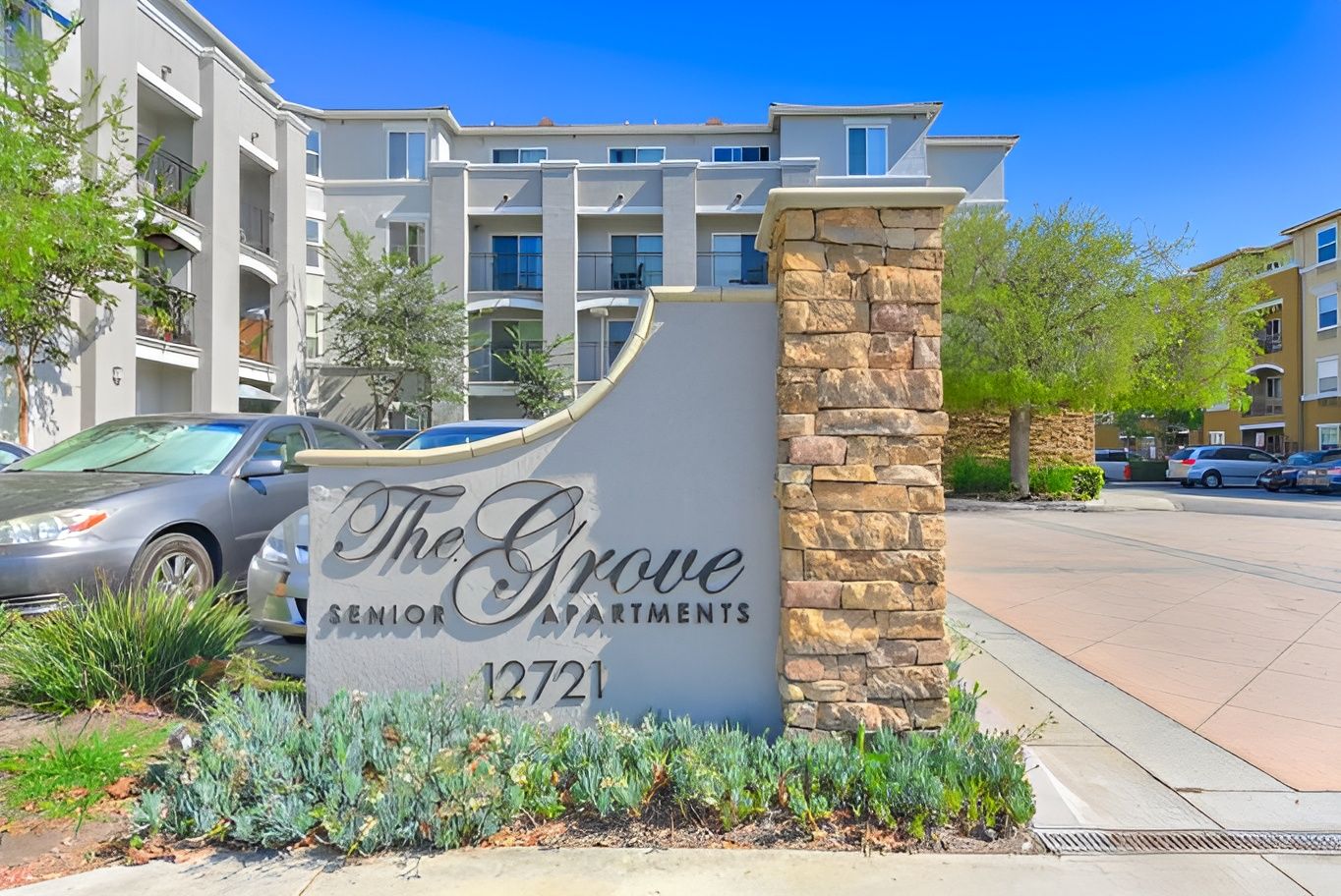 Exterior view of The Grove Senior Apartments building sign