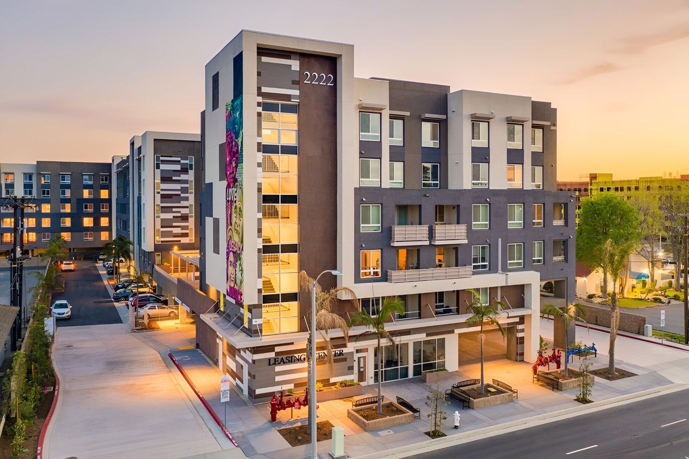 Modern assisted living facility exterior at sunset