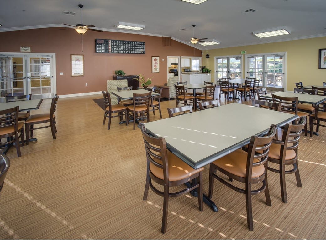 Bright dining area with tables and chairs